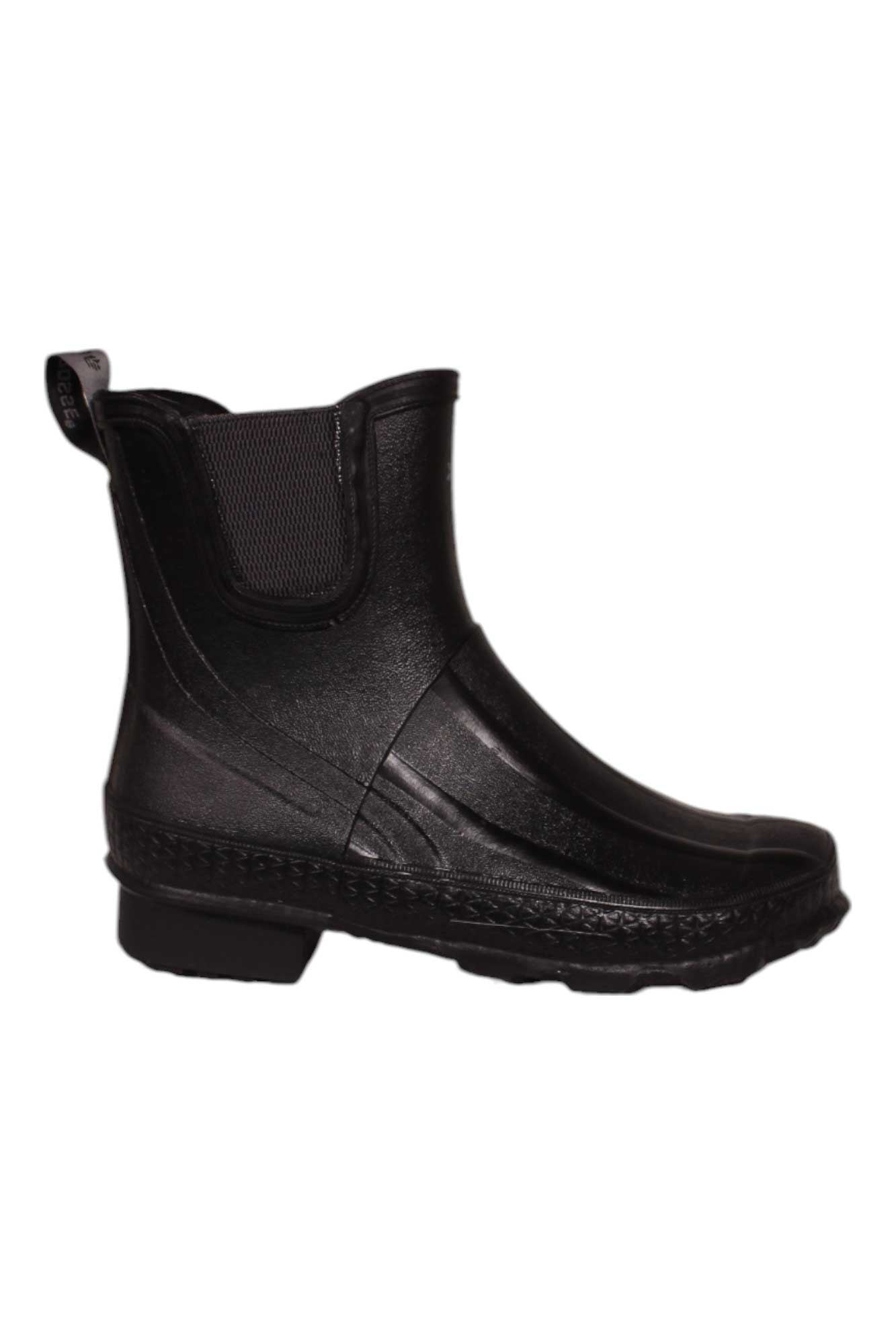The Lacrosse Womens Grange Chelsea 5 Boot is a black, ankle-high rubber boot with an ankle fit, textured sole, elastic side panel, and back pull tab. This waterproof women's boot is displayed in side profile against a white background.