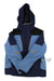 The Obermeyer Men's Foundation Jacket is a blue and navy ski jacket with black shoulder panels, front zipper, two zip pockets, reflective strip accents, a right sleeve tag, recycled material construction, and HydroBlock Pro weather protection.