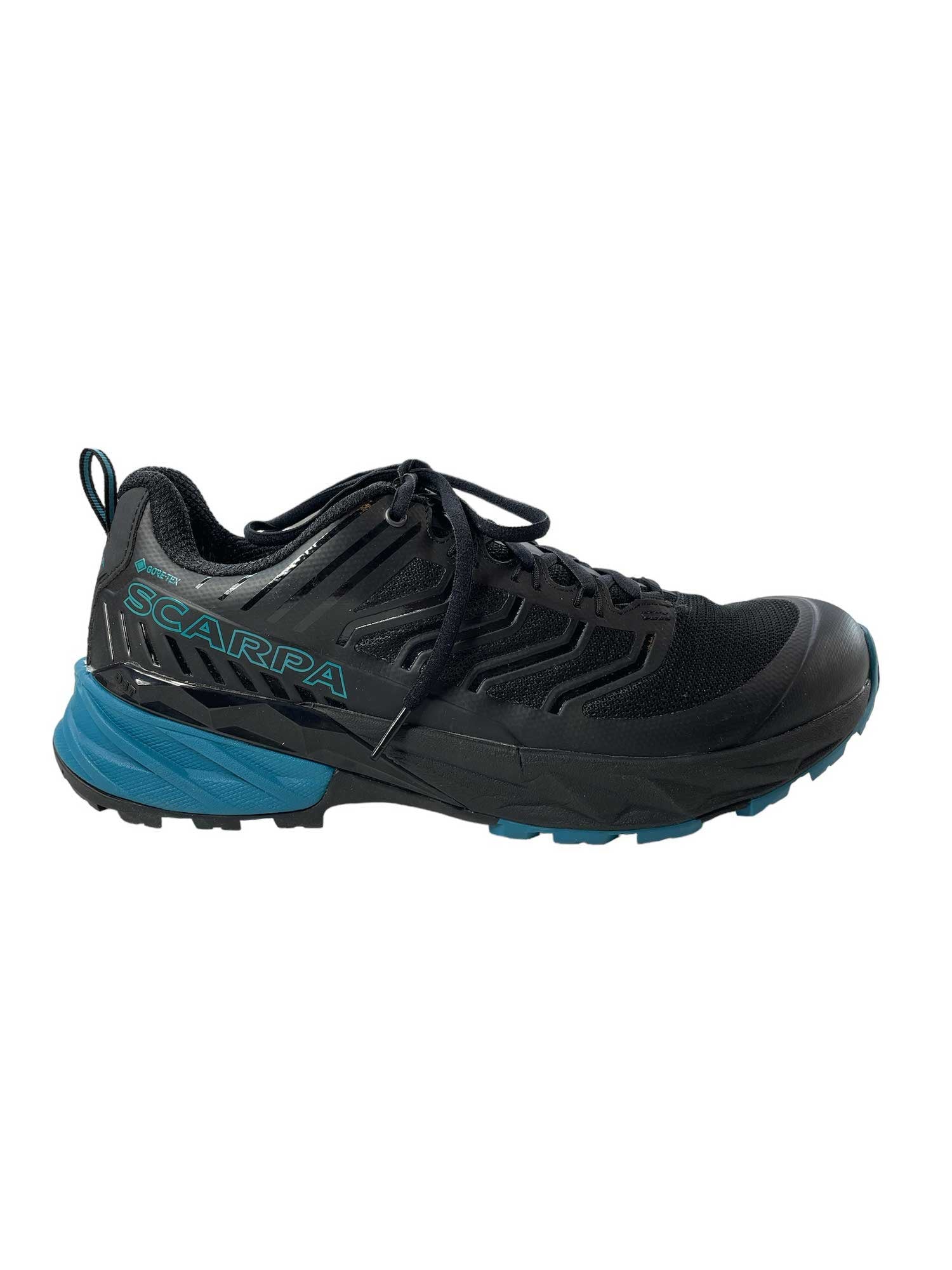 Black lace-up hiking shoe with teal outsole and textured side panels