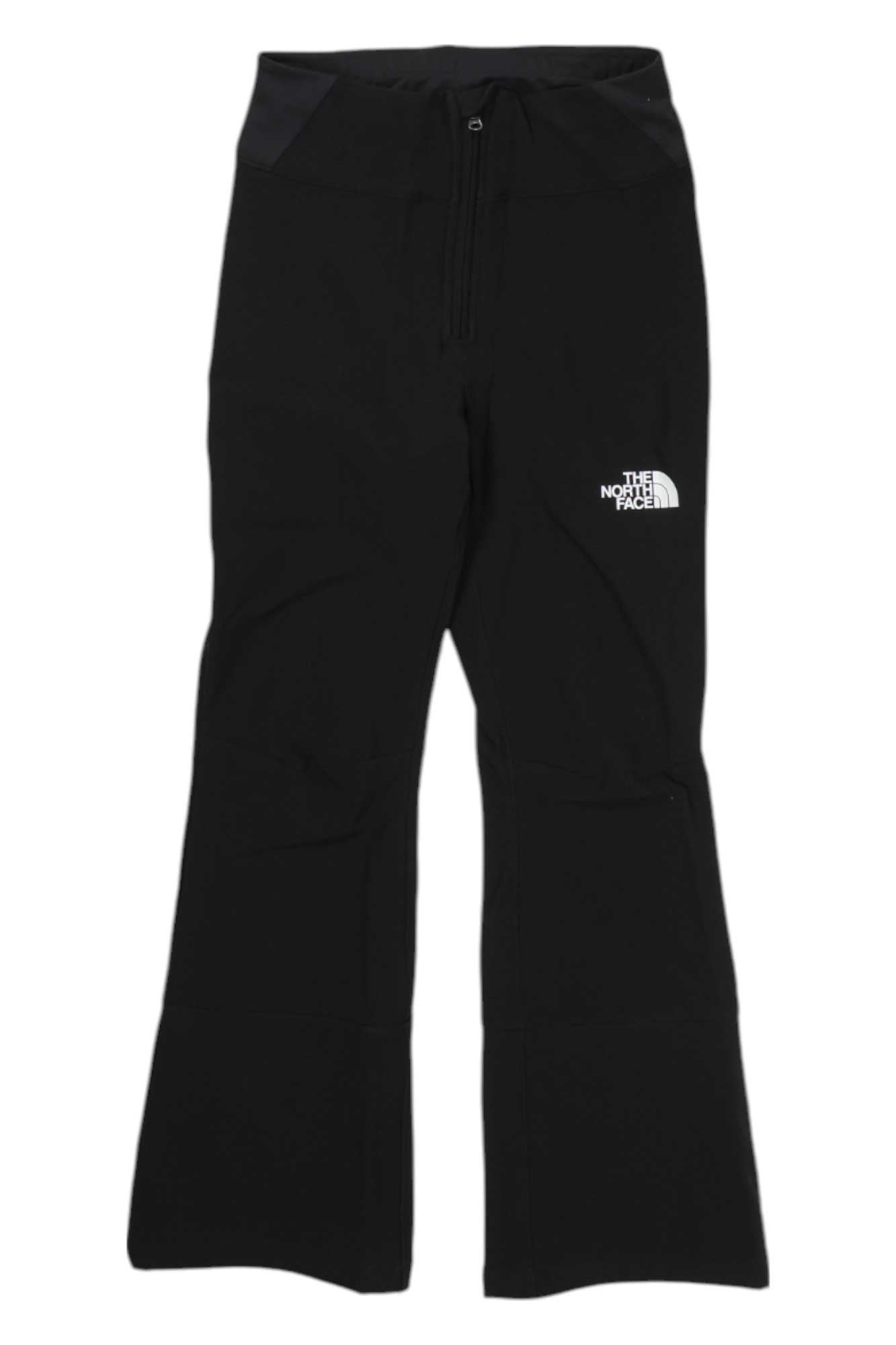 The North Face Girls Snoga Pant in black, featuring a front zipper and white logo on the left thigh, is displayed flat on a white background. These wind-resistant yoga pants offer seamless style and performance for girls.