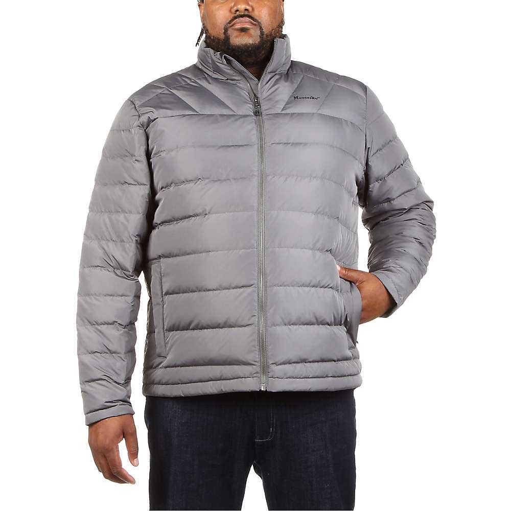 A man wears the Moosejaw Mens Down Insulator Jacket in light gray with water-resistant, horizontally quilted design, zipped up with a subtle logo on the left chest, paired with dark jeans and his right hand in the pocket.
