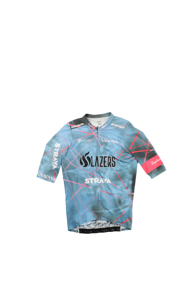 The Pro Team Aero Jersey II is a short-sleeve cycling jersey with a blue and pink geometric design, SLAZERS logo, STRAVA branding, and a pink Rapha logo on one sleeve, shown against a plain white background.