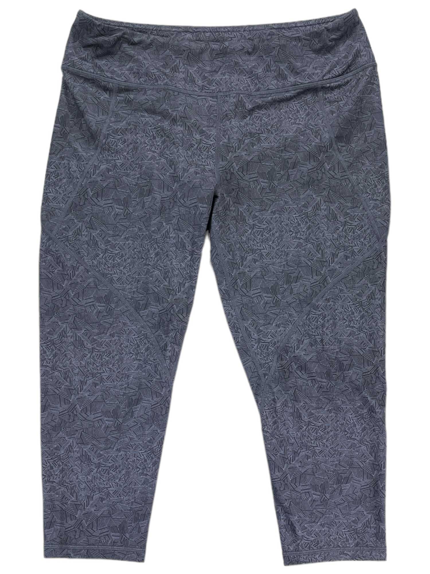 The Womens Centered Tights are high-waisted gray workout pants with a subtle leaf pattern, offering stylish comfort for women. They are displayed laid flat on a white background.
