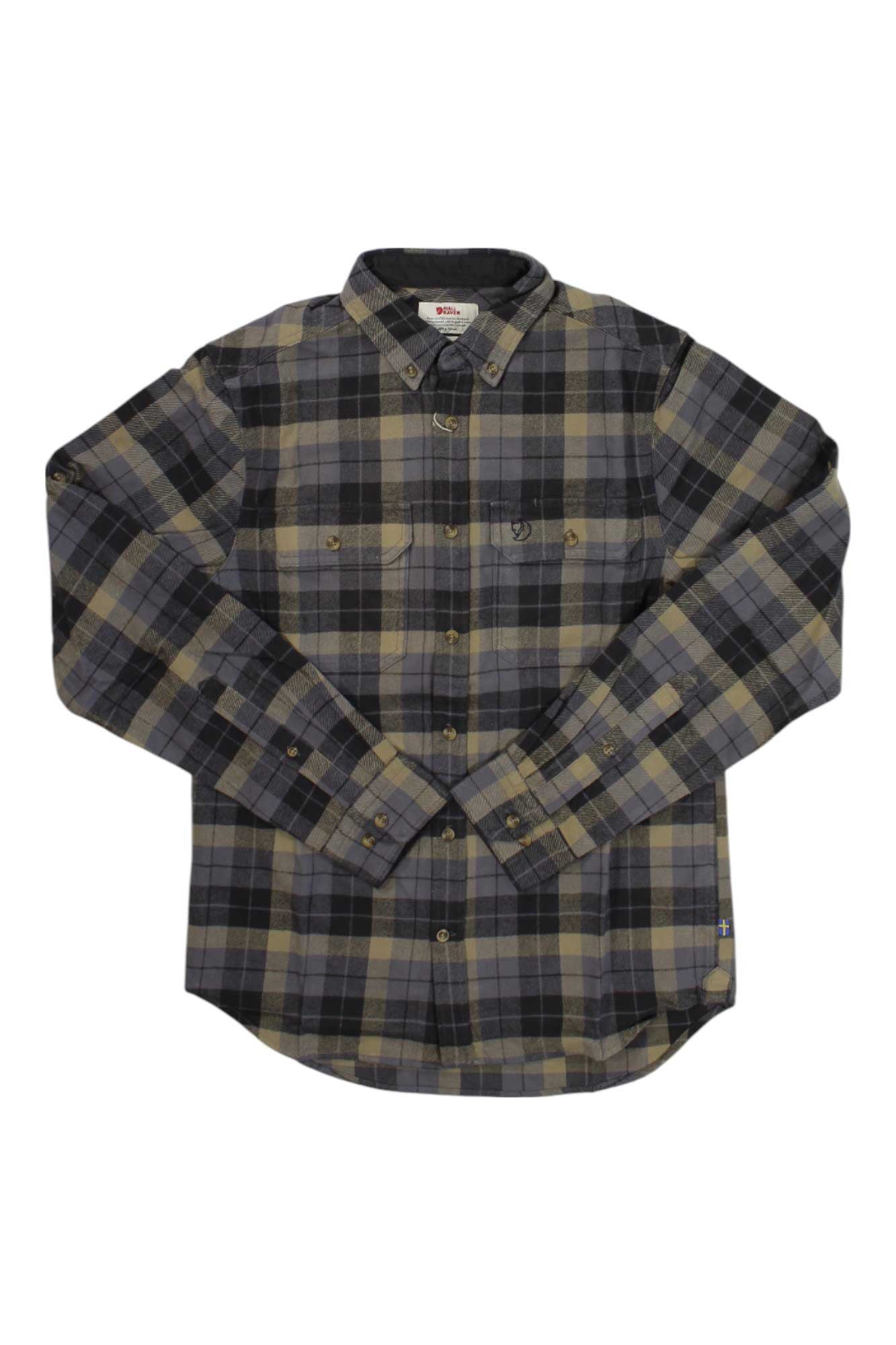 The Fjallraven Mens Singi Heavy Flannel Shirt is a long-sleeved, button-up cotton shirt with gray, black, and beige plaid, chest pockets, and a collar—ideal for hiking on cooler days.