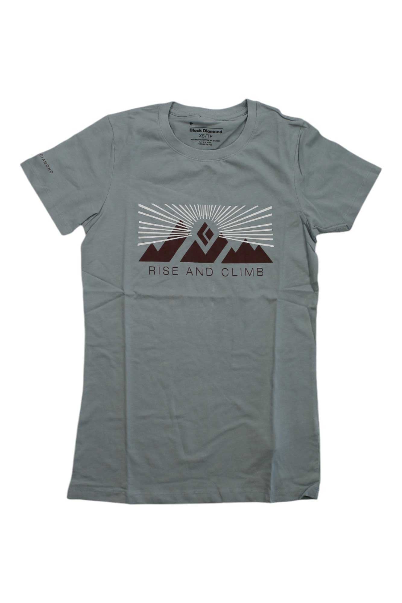 The Black Diamond Womens Rise and Climb Tee is a light gray organic cotton shirt featuring brown mountains, white sun rays, and "RISE AND CLIMB" on the front—a stylish pick for climbing enthusiasts.