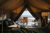 a well-stocked tent on a beach