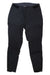 The Norrona Womens Falketind Rugged Slim Pant—black, slim-fit softshell pants with a zippered front, button closure, and side pockets—are versatile, all-year outdoor pants for style and performance. Shown laid flat on a white background.