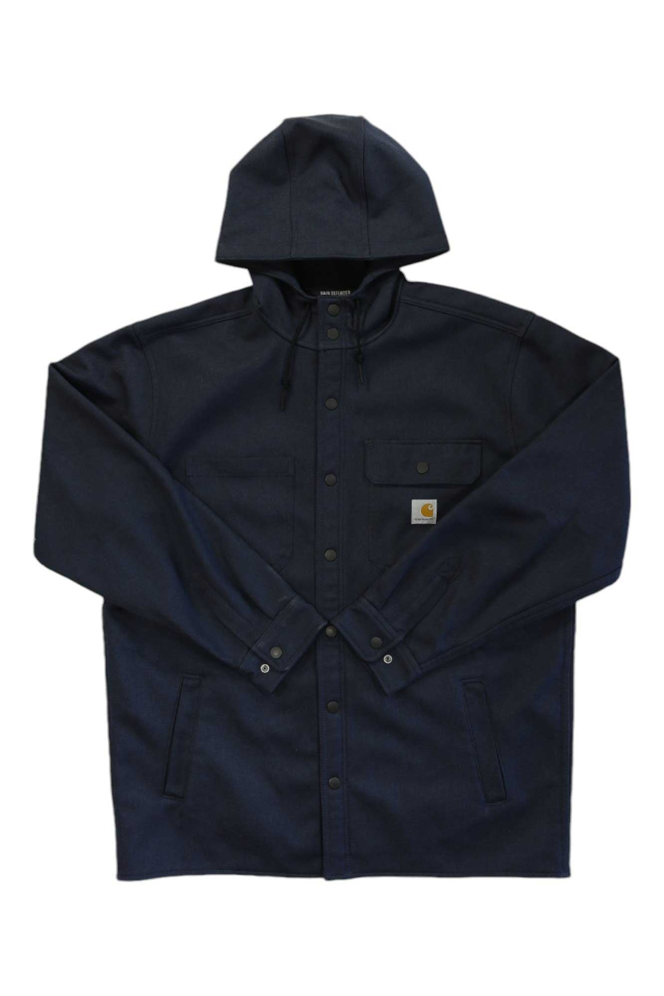 The Carhartt Mens Storm Defender Loose Fit Heavyweight Jacket in dark navy features front snap buttons, two side pockets, a button-flap chest pocket, waterproof Storm Defender tech, and a small Carhartt logo patch on the chest.