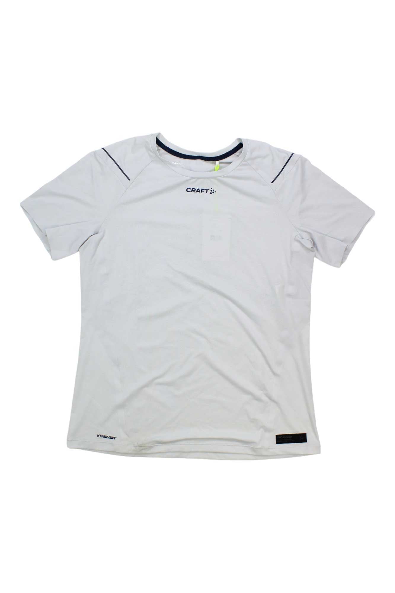 The Craft Sportswear Womens Pro Hypervent SS Tee is a plain white short sleeve t-shirt featuring subtle black stitching, a round neckline, and small logos on the chest and hem, shown laid flat on a white background.