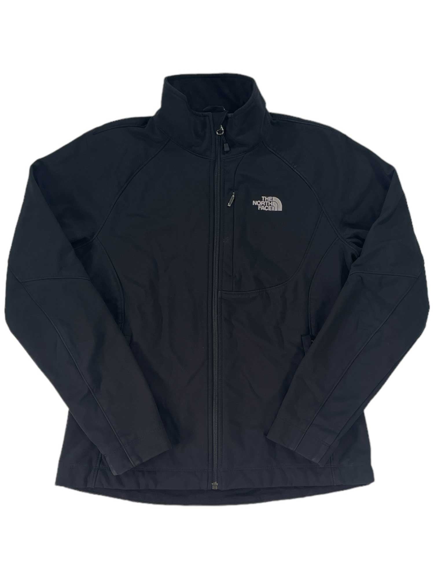 The Womens Apex Bionic Soft-Shell Jacket features a front zipper, high collar, long sleeves, and left chest logo. Windproof and black, it's ideal for outdoor adventures.
