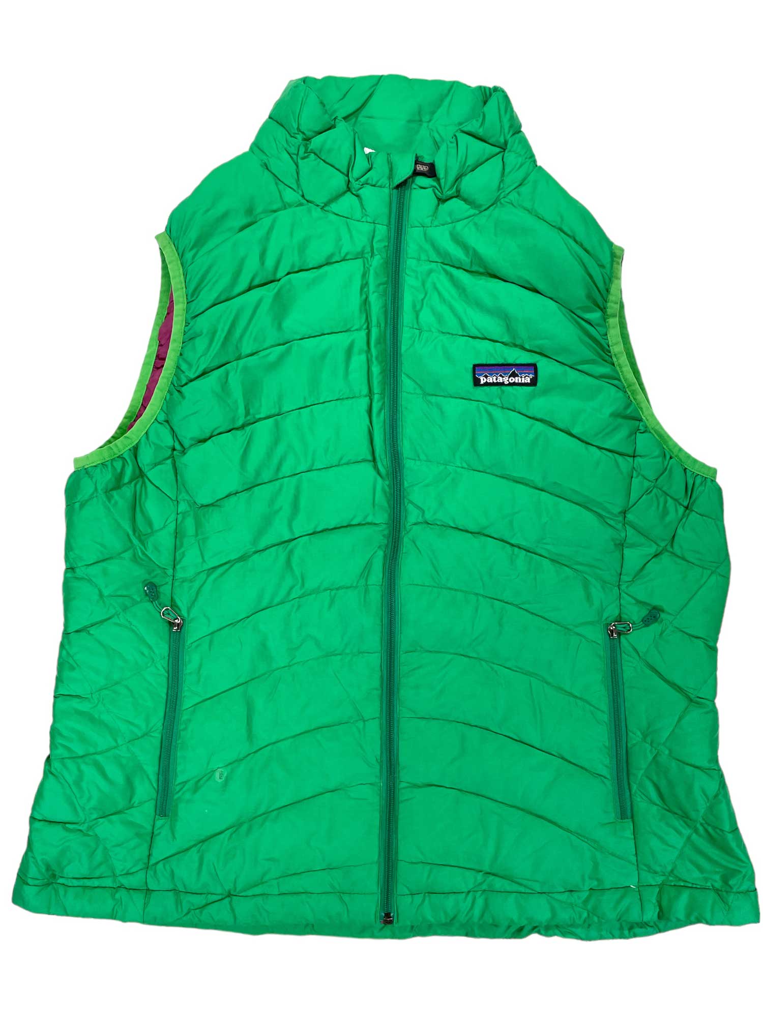The Women's Down Sweater Vest is a bright green, sleeveless vest with zippered pockets and front zip, made of recycled polyester, filled with 800-fill-power down, and finished with a “Patagonia” logo patch on the left chest.