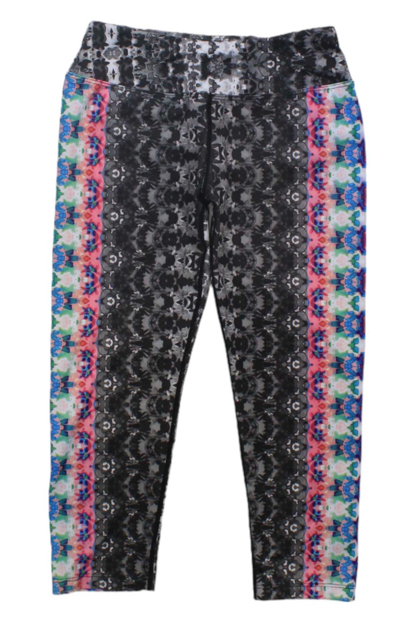 Experience vibrant movement in the Womens Roxanne Capris, featuring a black and gray abstract center with bold blue, pink, and orange geometric side designs, all crafted from a micropoly performance jersey.