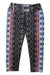 Experience vibrant movement in the Womens Roxanne Capris, featuring a black and gray abstract center with bold blue, pink, and orange geometric side designs, all crafted from a micropoly performance jersey.