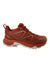 The Helly Hansen Womens Cascade Low HT Shoe is a rust-colored trail runner with a rugged textured sole, mesh and synthetic upper, white outsole, laces, and heel pull tab—designed for outdoor hiking and adventure.
