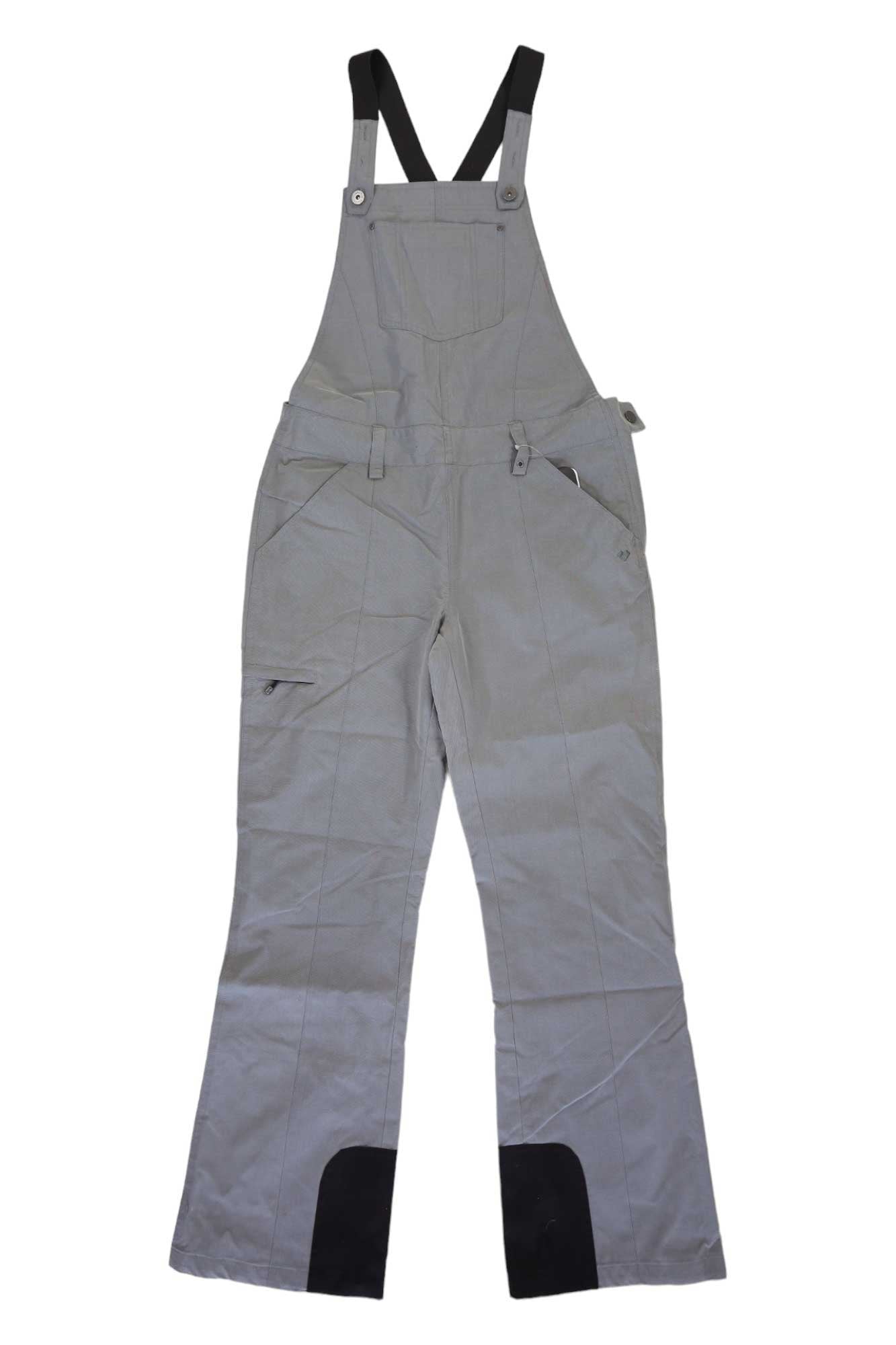 The Obermeyer Womens Malta Overalls Bib is a gray ski bib with black adjustable shoulder straps, a front chest pocket, side pockets, and black reinforced lower leg patches, shown laid flat on a white background.