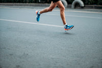 a person wearing colorful running shoes