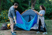 couple setting up a campsite