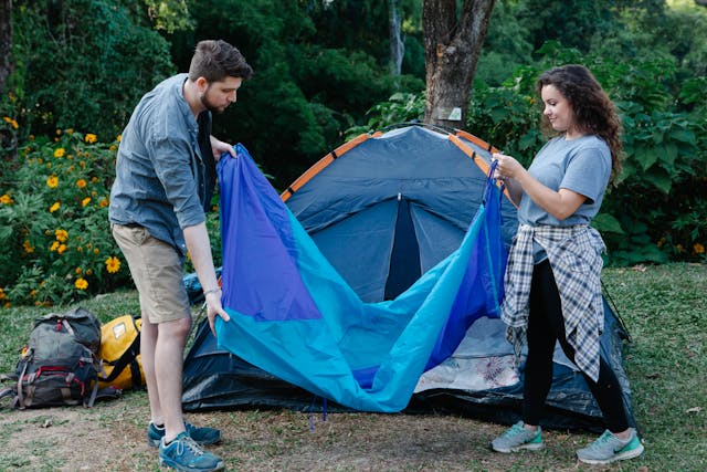 couple setting up a campsite