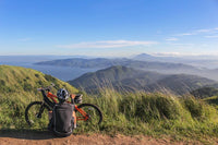 cyclist sitting with a bicycle