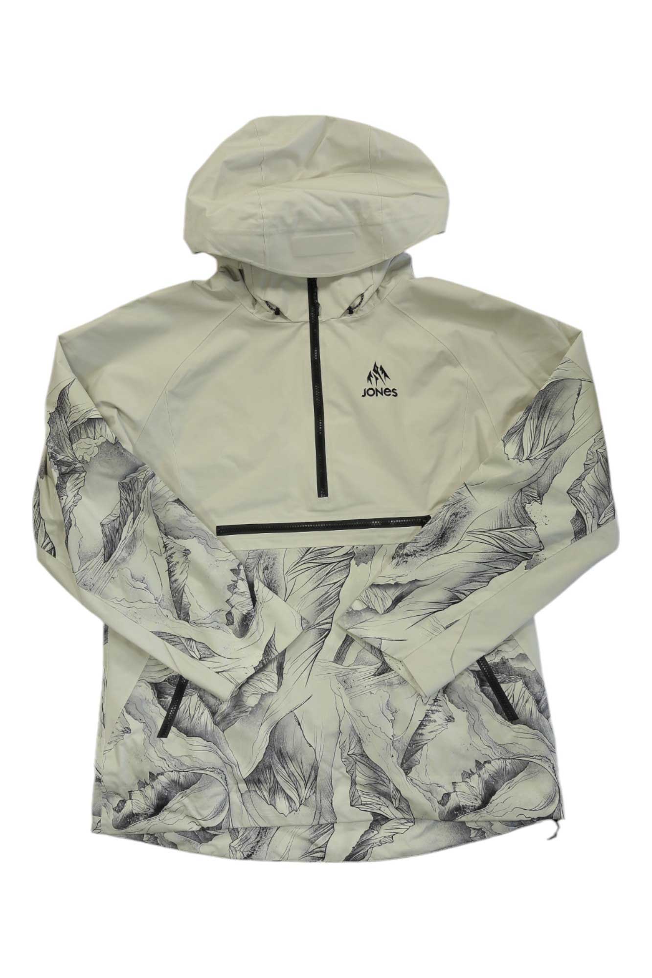 The Jones Womens MTN Surf Recycled Anorak is cream-colored with a hood, half-zip front, black zippers, Jones logo on the chest, and a botanical leaf print on the lower half and sleeves. It includes a RECCO reflector for extra safety.