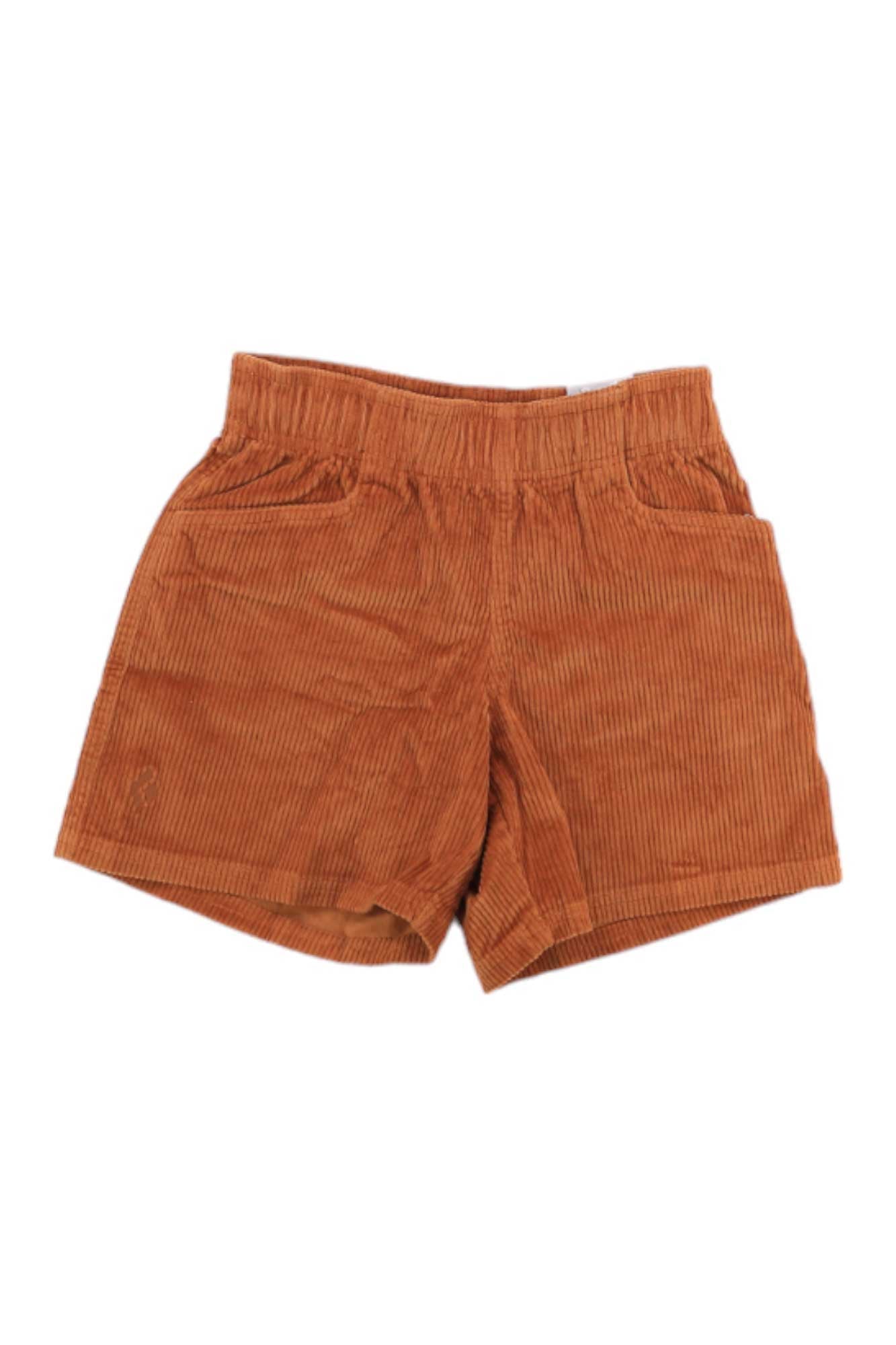 The Black Diamond Womens Dirtbag Short in rust is made from organic cotton corduroy, features an elastic waistband and front pockets, and is shown laid flat on a white background.