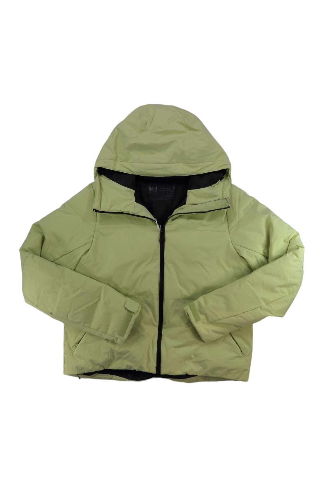 A light green Helly Hansen Womens Nora Short Puffy Jacket with an adjustable hood, front zipper, long sleeves, and side pockets is laid flat on a white background.
