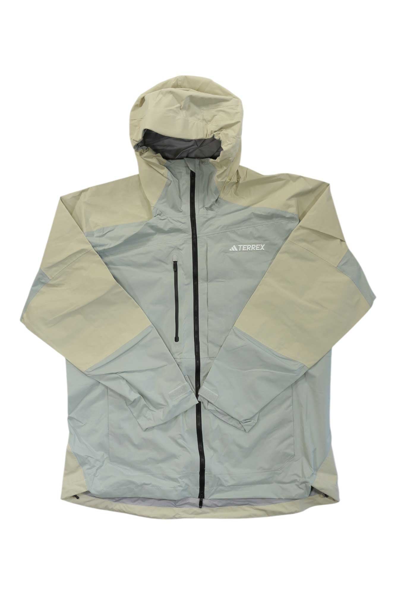 The Adidas Mens Terrex Xploric Rain.Rdy Jacket is a beige and light gray waterproof hiking jacket with recycled polyester ripstop, a front zipper, vertical zippered chest pocket, and hood for outdoor protection.