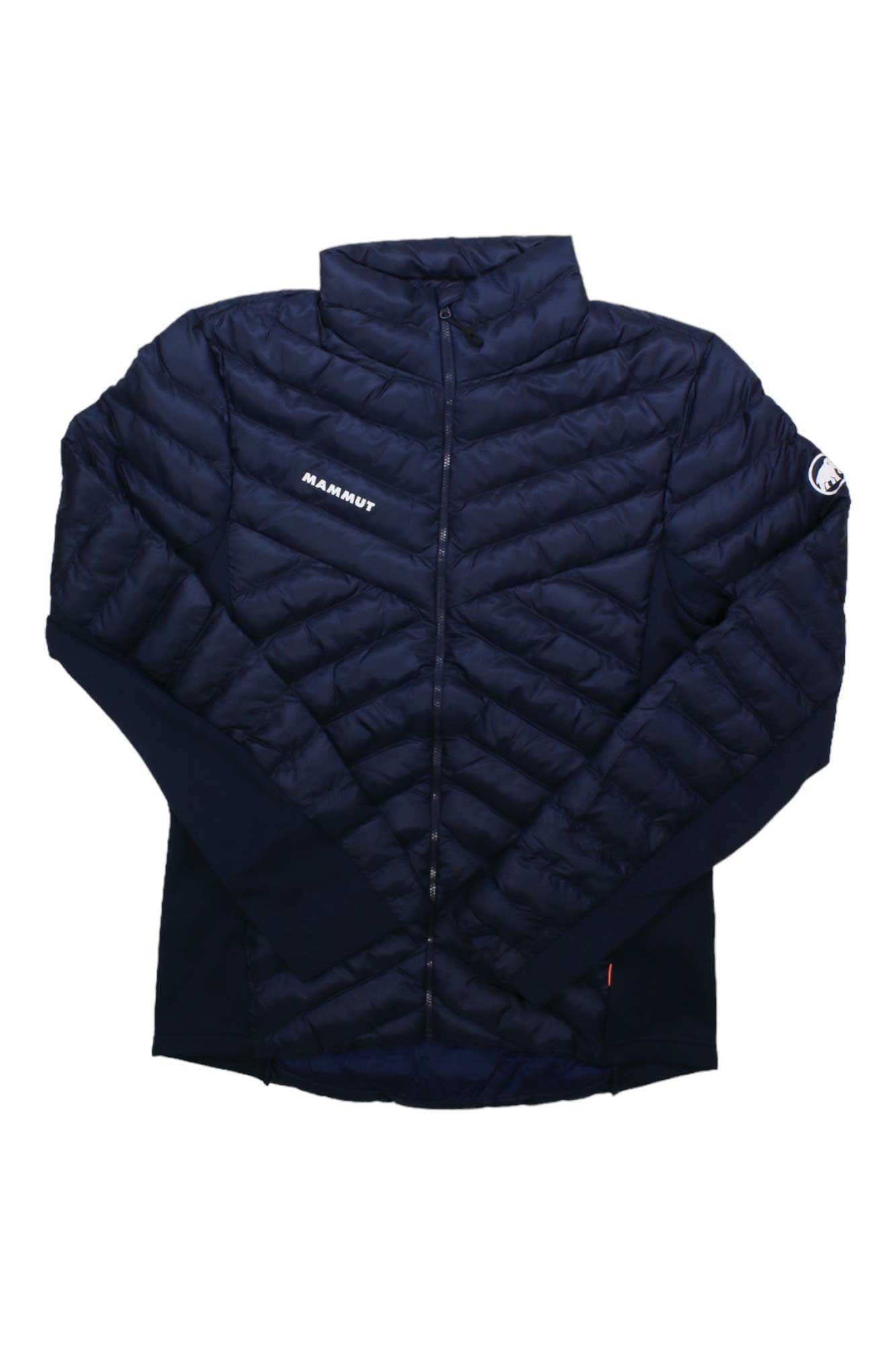 The Mammut Men's Albula IN Hybrid Jacket in navy blue features synthetic insulation, a front zipper, chevron stitching, and logo details on the chest and left sleeve, shown against a white background.