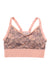 The Kari Traa Women's Froya Bra is a peach-colored bralette with adjustable straps and a floral lace front, providing light support and all-day comfort, similar to a women's sports bra.