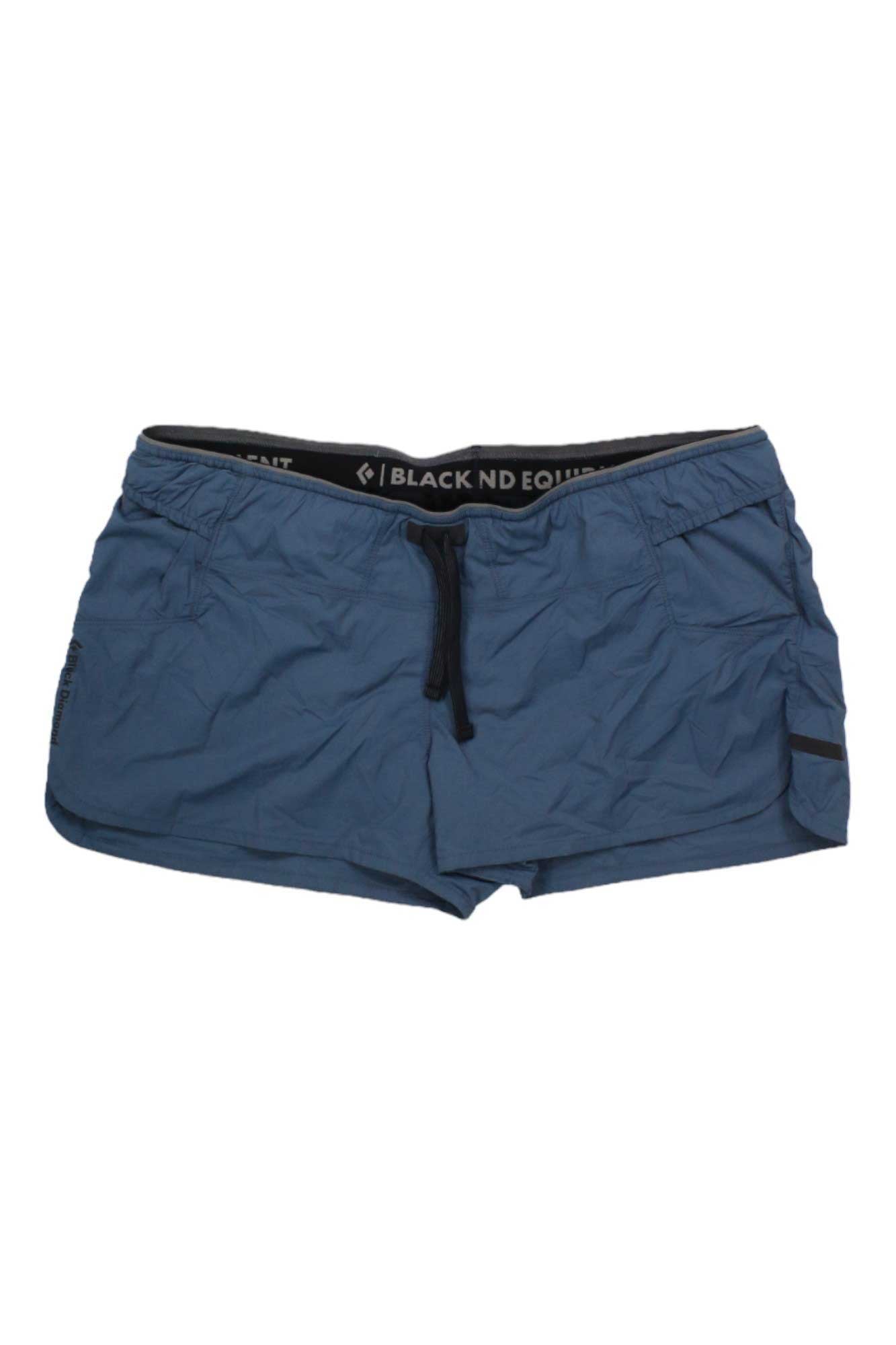 The Black Diamond Womens Sprint 2.5 Inch Short features blue athletic fabric, an elastic waistband with black drawstring, side pockets, a small black label on one leg, quick-drying material, and a lightly wrinkled texture.