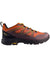 The Helly Hansen Mens Cascade Low HT Shoe in orange and black with yellow accents and laces offers stylish, waterproof footwear for outdoor adventures.