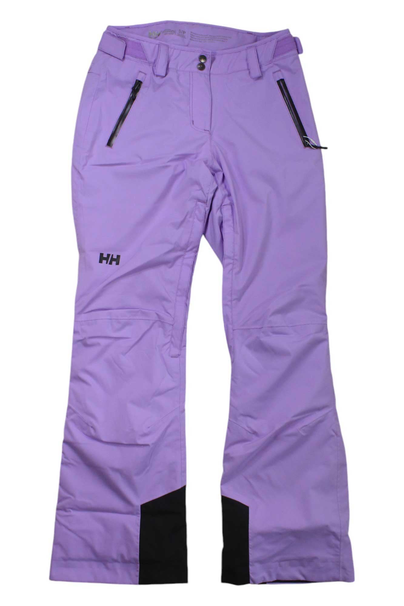 A pair of lavender purple Helly Hansen Womens Legendary Insulated Pants featuring black ankle patches, two front zippered pockets, belt loops, and the HH logo on the upper left thigh.