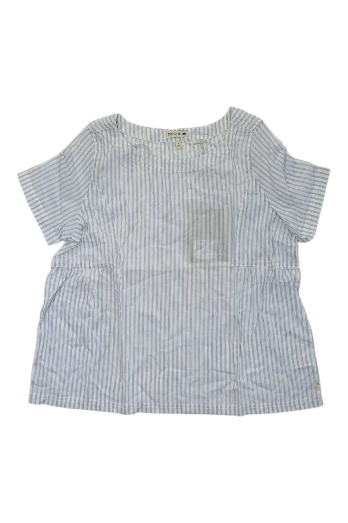 The Toad & Co Womens Indigo Swong Top is a light blue and white short-sleeve shirt with vertical stripes, a round neckline, and a loose fit—ideal for versatile outdoor casual wear.