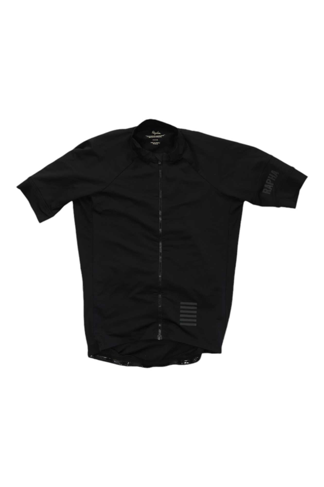 The Rapha Pro Team Training Jersey is a black, short-sleeved, high-performance cycling jersey with a full front zip, subtle left sleeve branding, and tone-on-tone lower right stripes—designed for riders who demand quality.