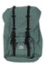 The Little America Backpack features green canvas, a flap cover, two black buckle straps, front pocket, padded laptop sleeve, and a white rectangular Herschel label on the front pocket.
