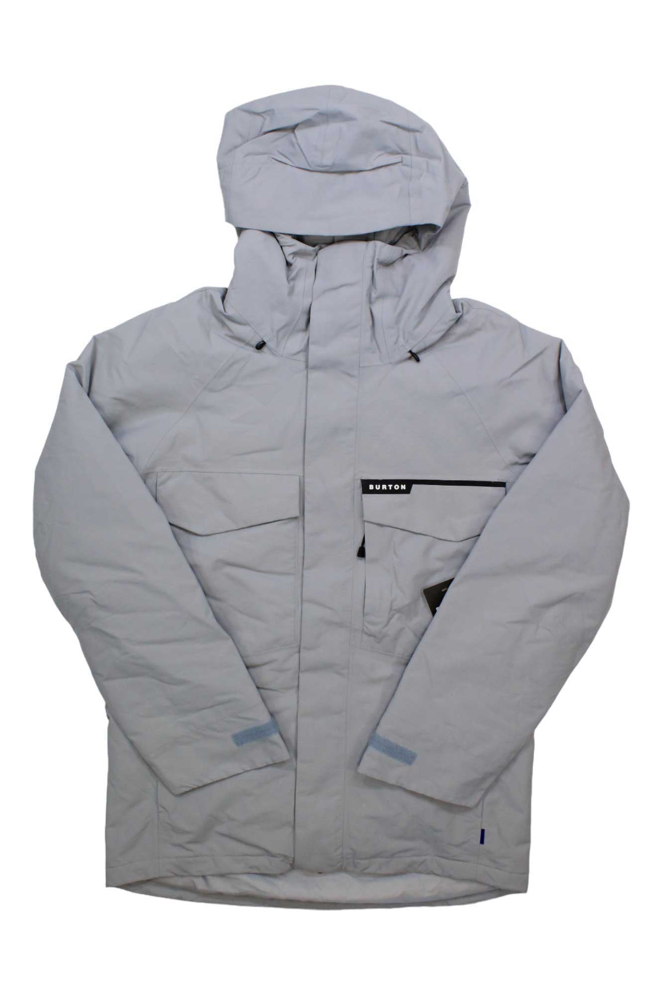 A light gray Burton Men's Covert 2.0 Jacket, waterproof with a hood, zipper and snap closure, black Burton logo on the chest pocket, and two side pockets—displayed flat on a white background.