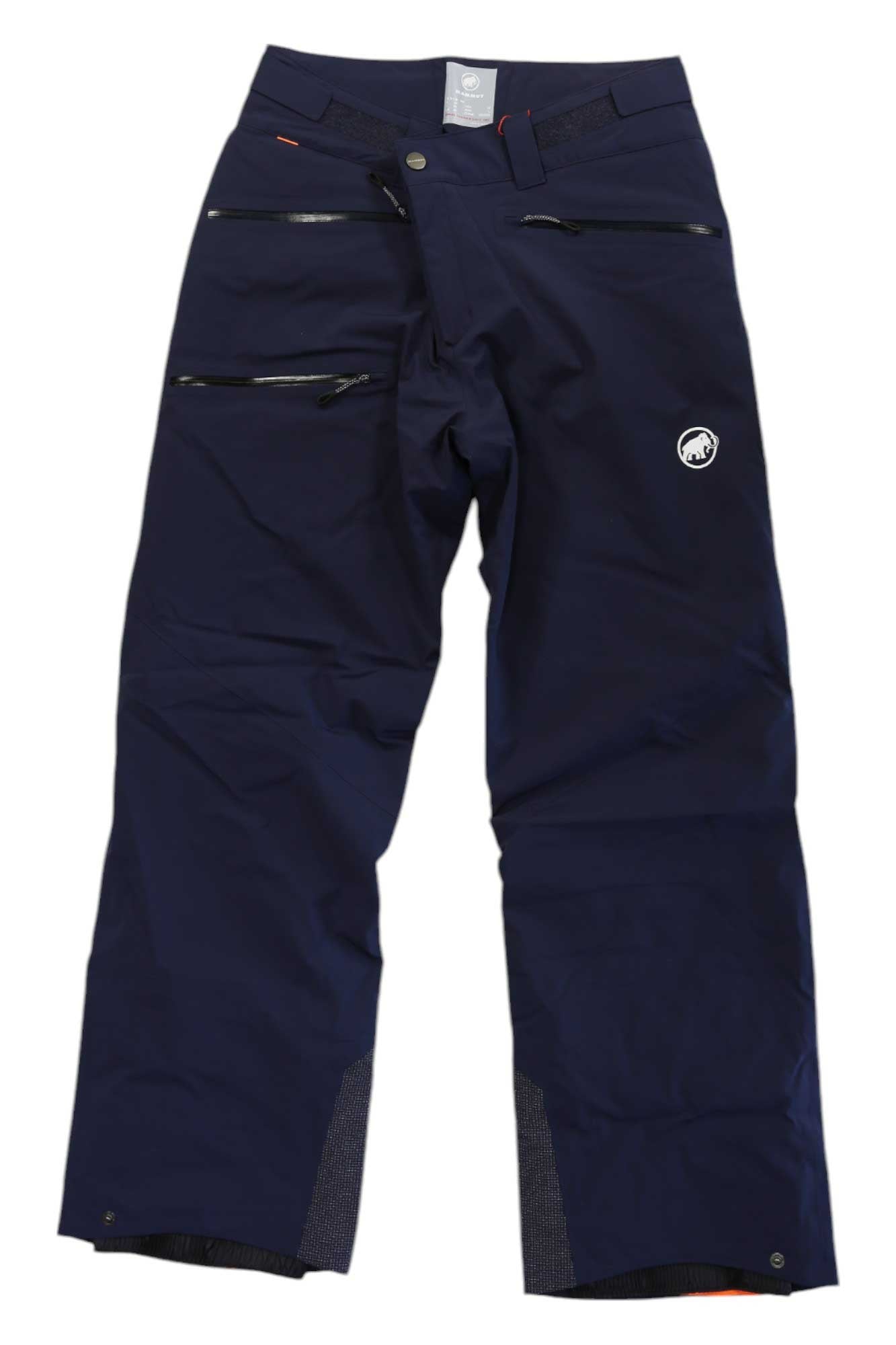 The Mammut Mens Stoney HS Thermo Pant in navy blue features multiple zippered pockets, reinforced cuffs, a small white logo on the left thigh, and insulation. Shown laid flat from the front.