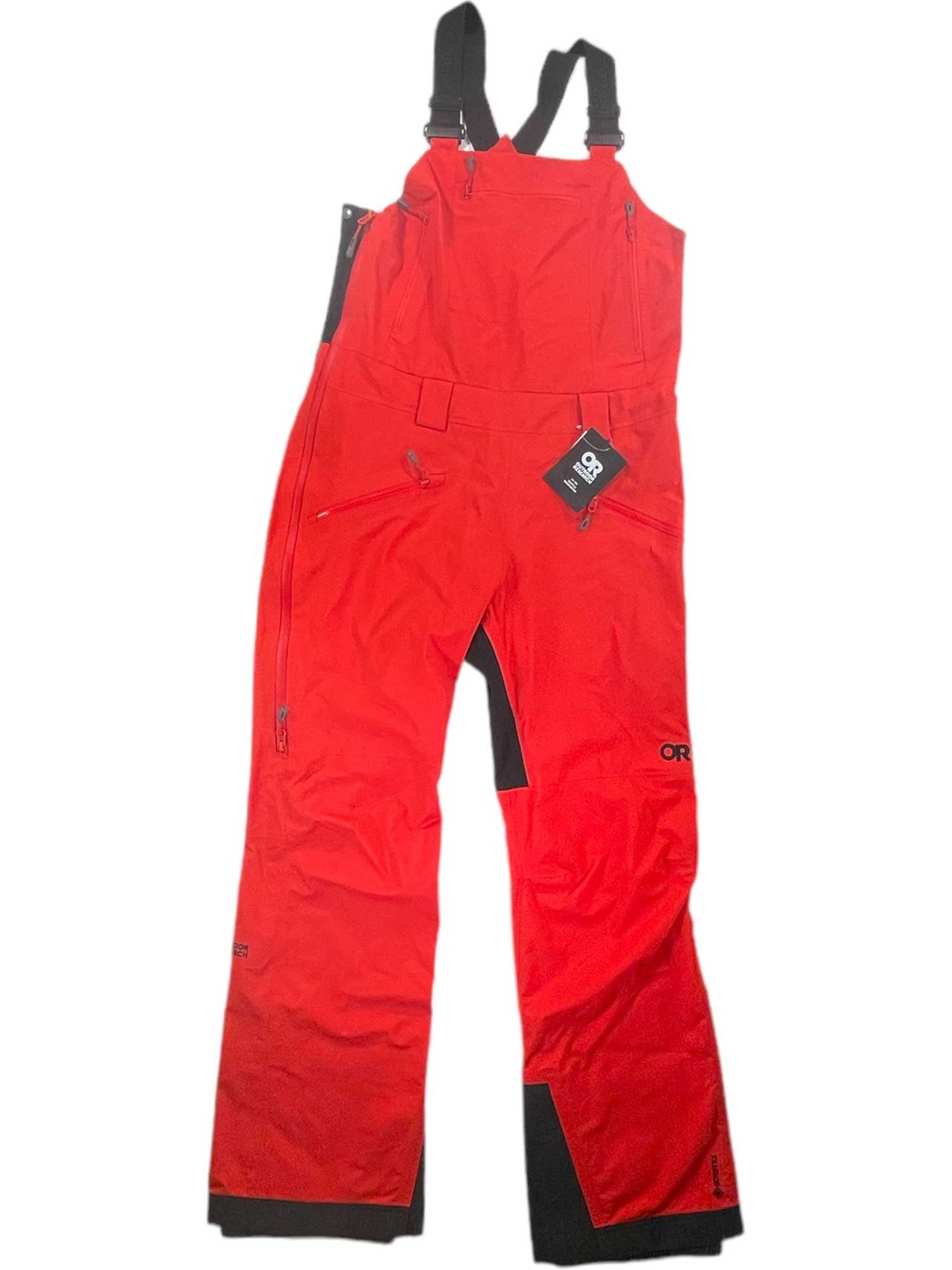 The Outdoor Research Women's Hemispheres II Bib Pant is a bright red waterproof ski bib with black adjustable shoulder straps, reinforced ankle cuffs, zippered pockets, GORE-TEX fabric, and chest tag, shown laid flat on a white background.