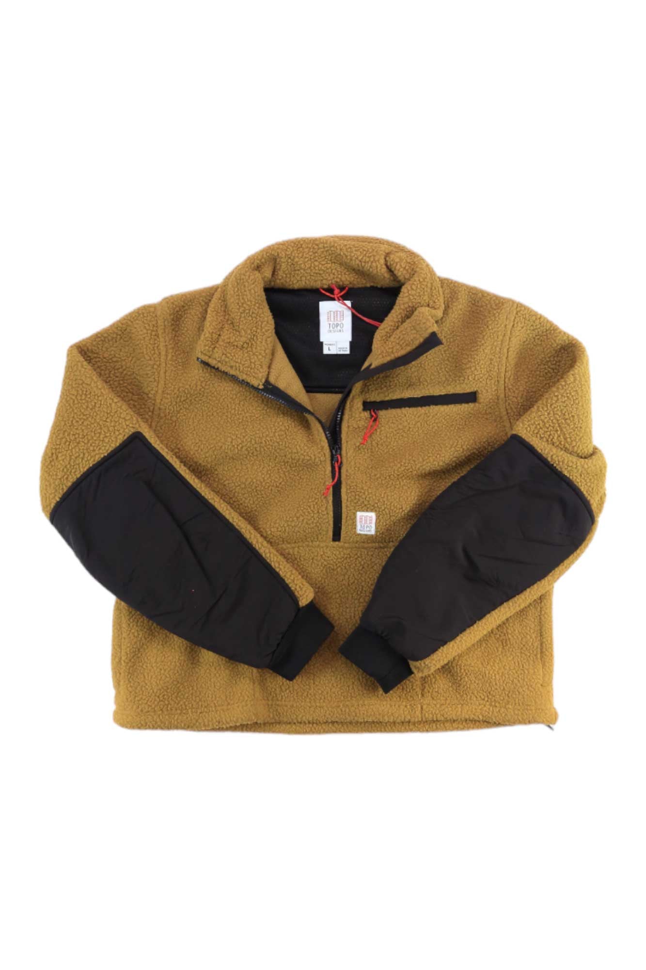 The Topo Designs Womens Mountain Fleece Pullover—made from recycled polyester—features a tan color, quarter zipper, chest pocket with red zipper, and black sleeve patches; shown laid flat on a white background.