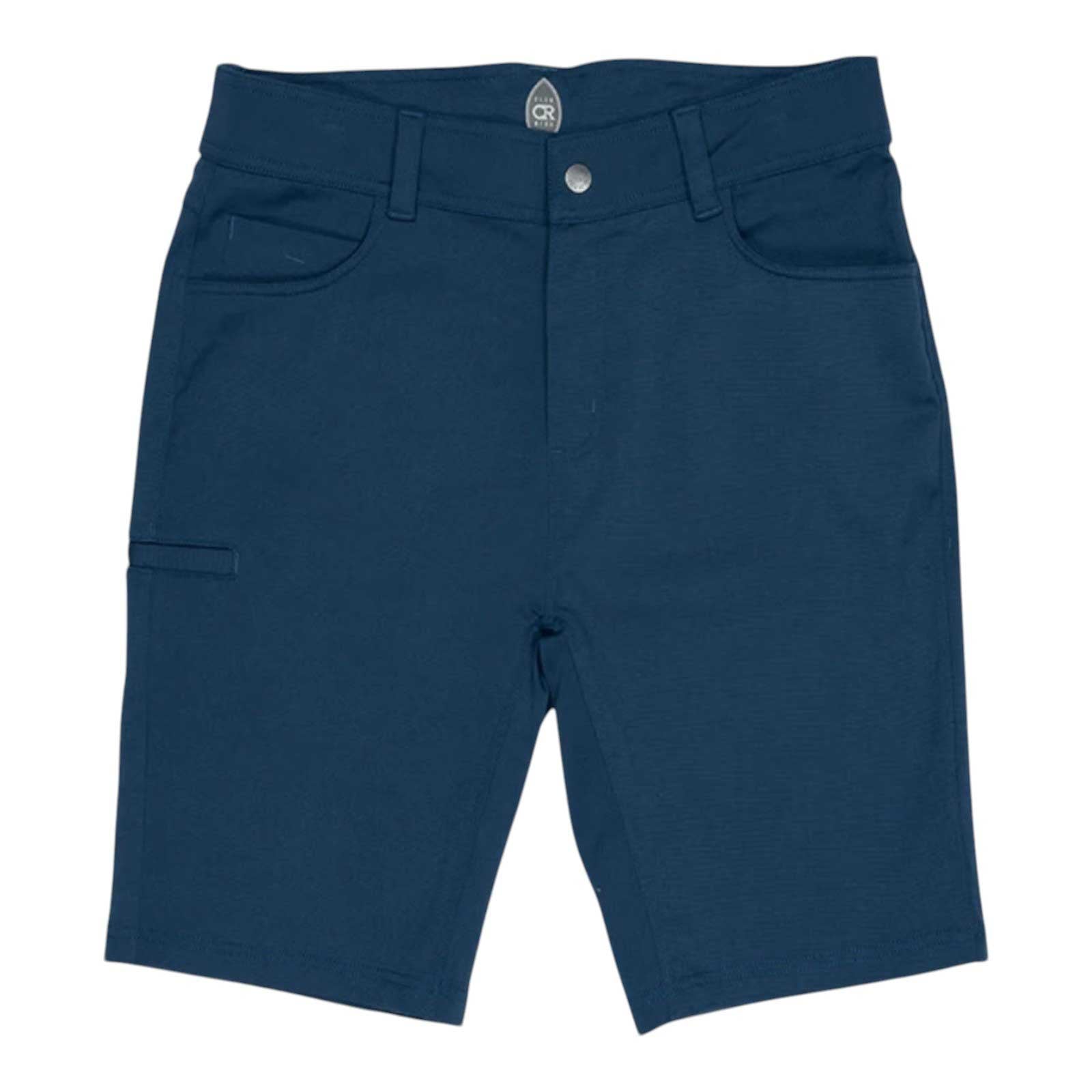 The Club Ride Men's Joe Dirt 12 Inch Short features navy blue 4-way stretch fabric, front and back pockets, belt loops, and a button waistband. Its clean design and slightly fitted cut are ideal for biking or daily wear.