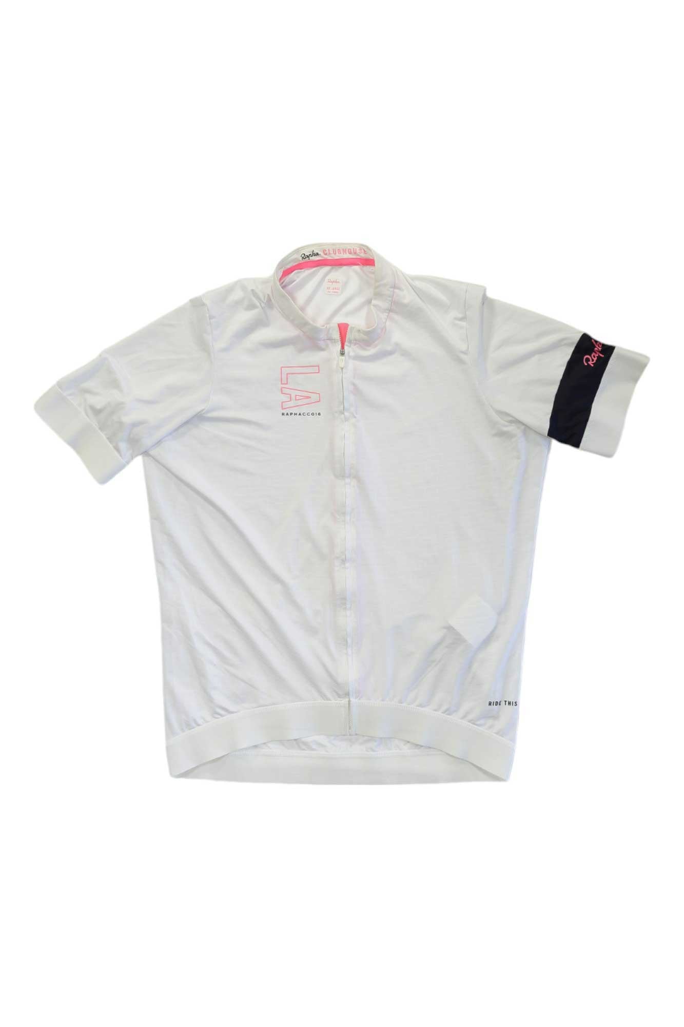 The Rapha Mens Clubhouse Jersey is a white short-sleeve cycling top featuring a front zipper, subtle pink accents, a navy band on the left sleeve, and Rapha branding.