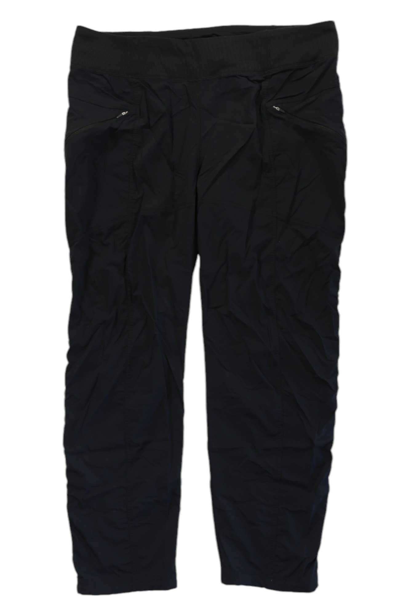 The Prana Womens Koen Pant is a black performance pant for women, featuring a wide waistband and two small zippered front pockets—ideal for athletics, hiking, or casual wear—shown flat on a white background.
