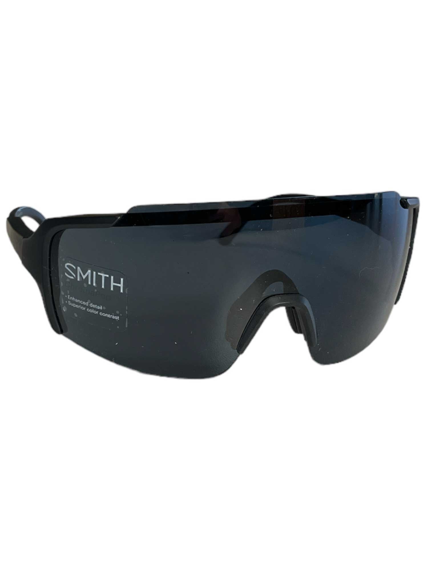 The Smith Flywheel ChromaPop Sunglasses feature a sleek black wraparound design, dark ChromaPop lenses, and adjustable nose pads. With the SMITH logo on the left lens, they’re ideal for skiing and outdoor activities.