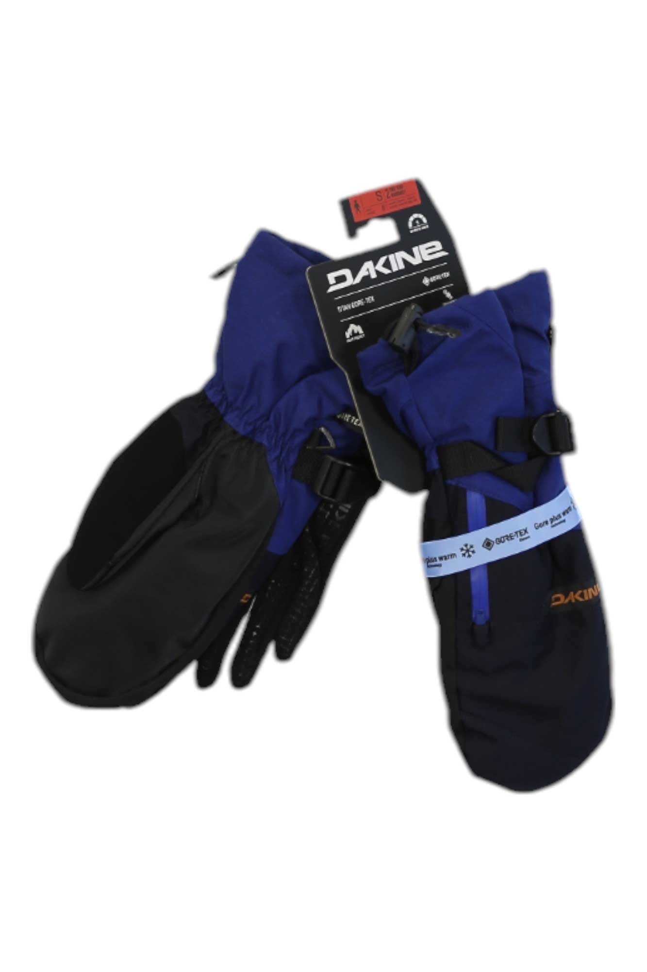A pair of Dakine Mens Titan GTX Mitt cold-weather gloves with tags, featuring blue and black colors, adjustable straps, and visible branding on the cuffs and tags, displayed against a white background.