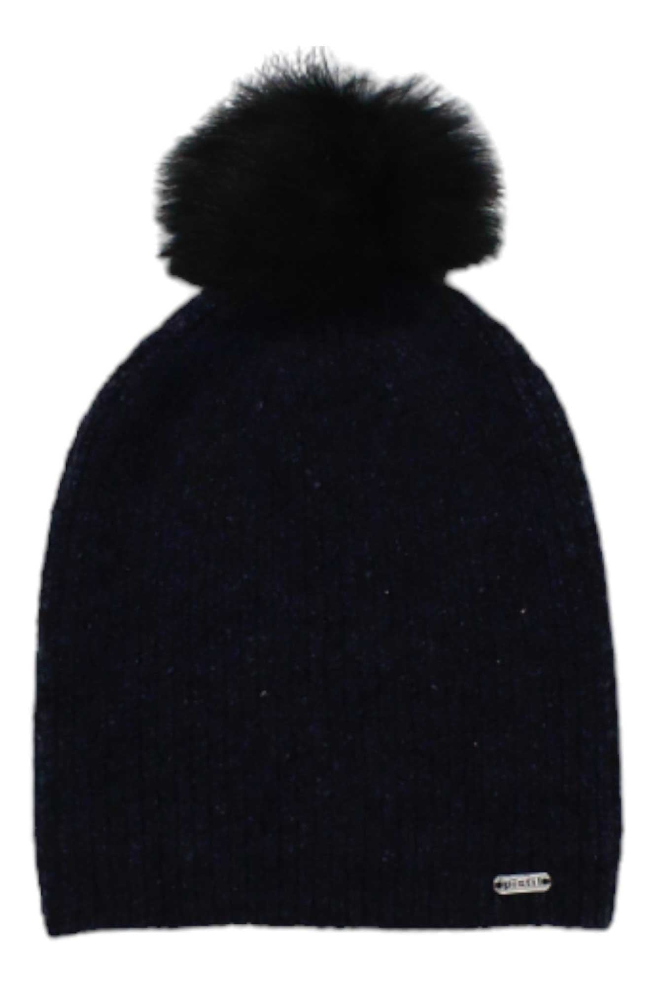 The Pistil Womens Lauren Beanie is a black, knitted winter hat for women made from recycled polyester, featuring a large faux fur pom and a small metallic brand tag near the bottom edge.