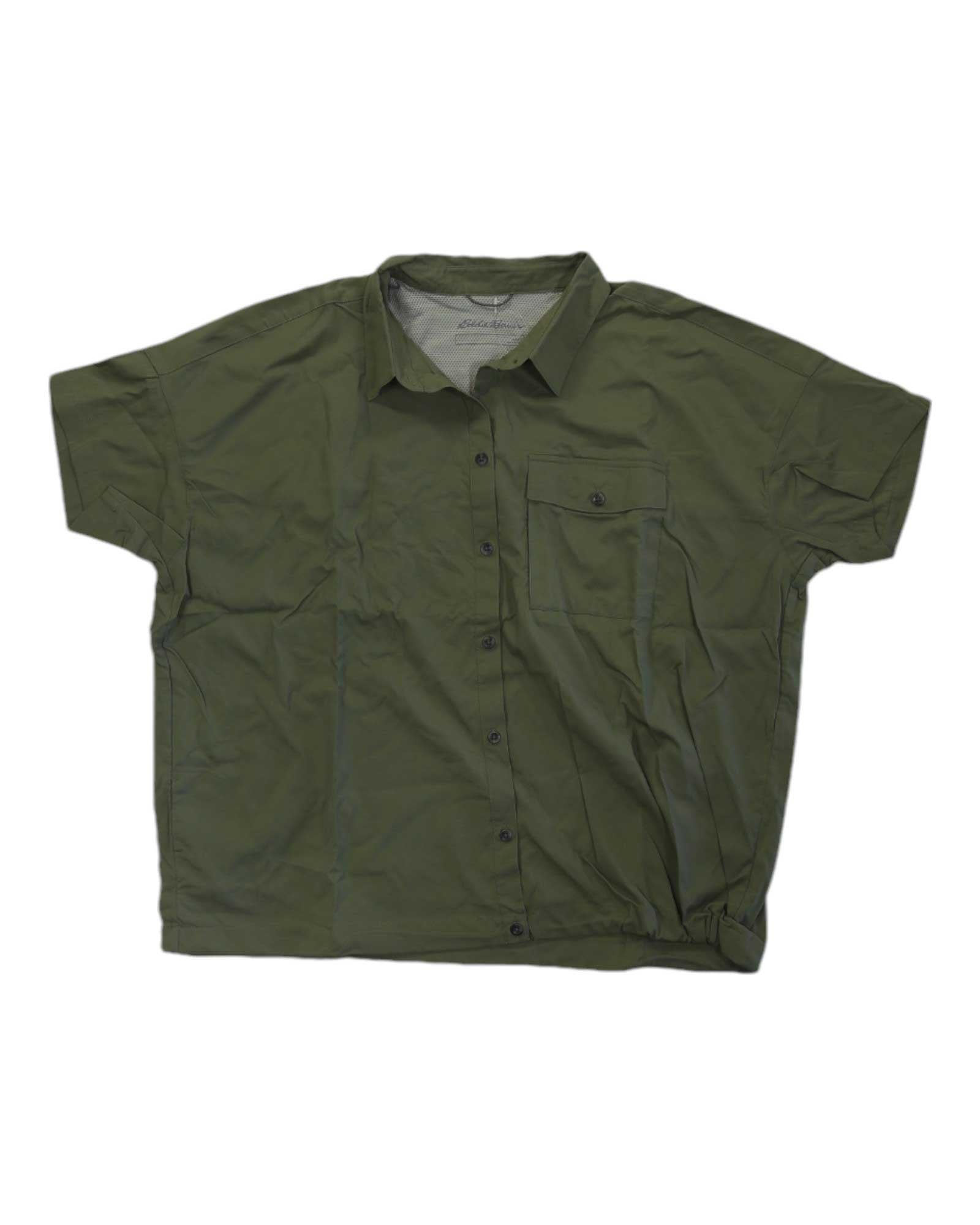 The Eddie Bauer Travex Women's Pave The Way SS Shirt in olive green features short sleeves, a collar, UPF 50 protection, moisture-wicking fabric, and a single chest pocket. It's displayed flat on a white background.