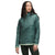 A woman models The North Face Womens Circaloft 1/4 Zip Pullover in teal with synthetic insulation and a high collar, standing against a white background, facing slightly left with hands relaxed at her sides.