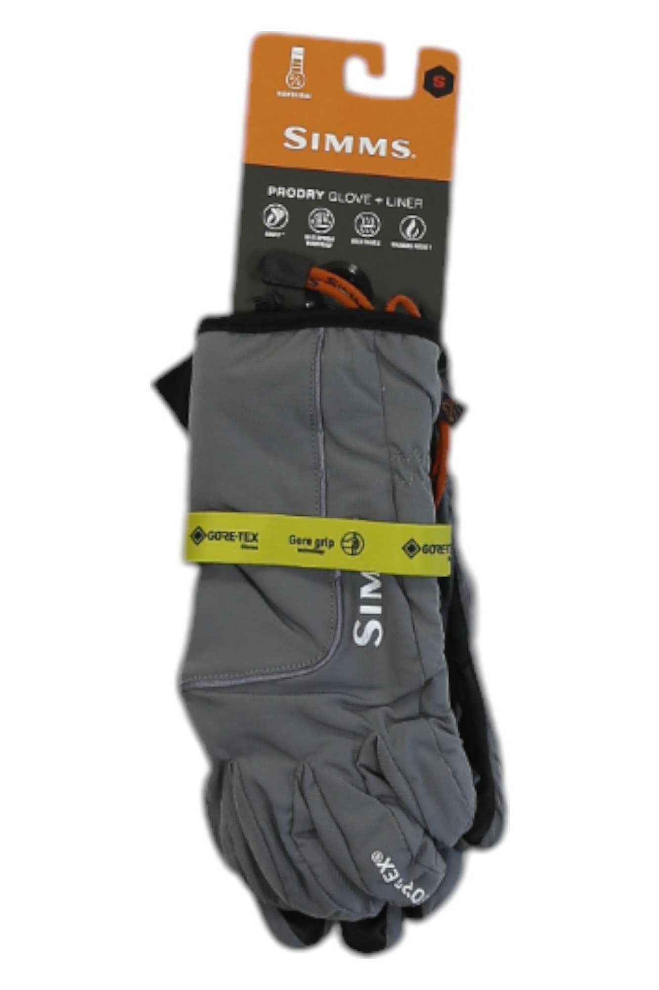 A pair of gray Simms ProDry Glove + Liner—waterproof gloves featuring Gore-Tex Gene Grip technology—are attached to retail packaging with visible product details and branding, ideal for outdoor glove enthusiasts.
