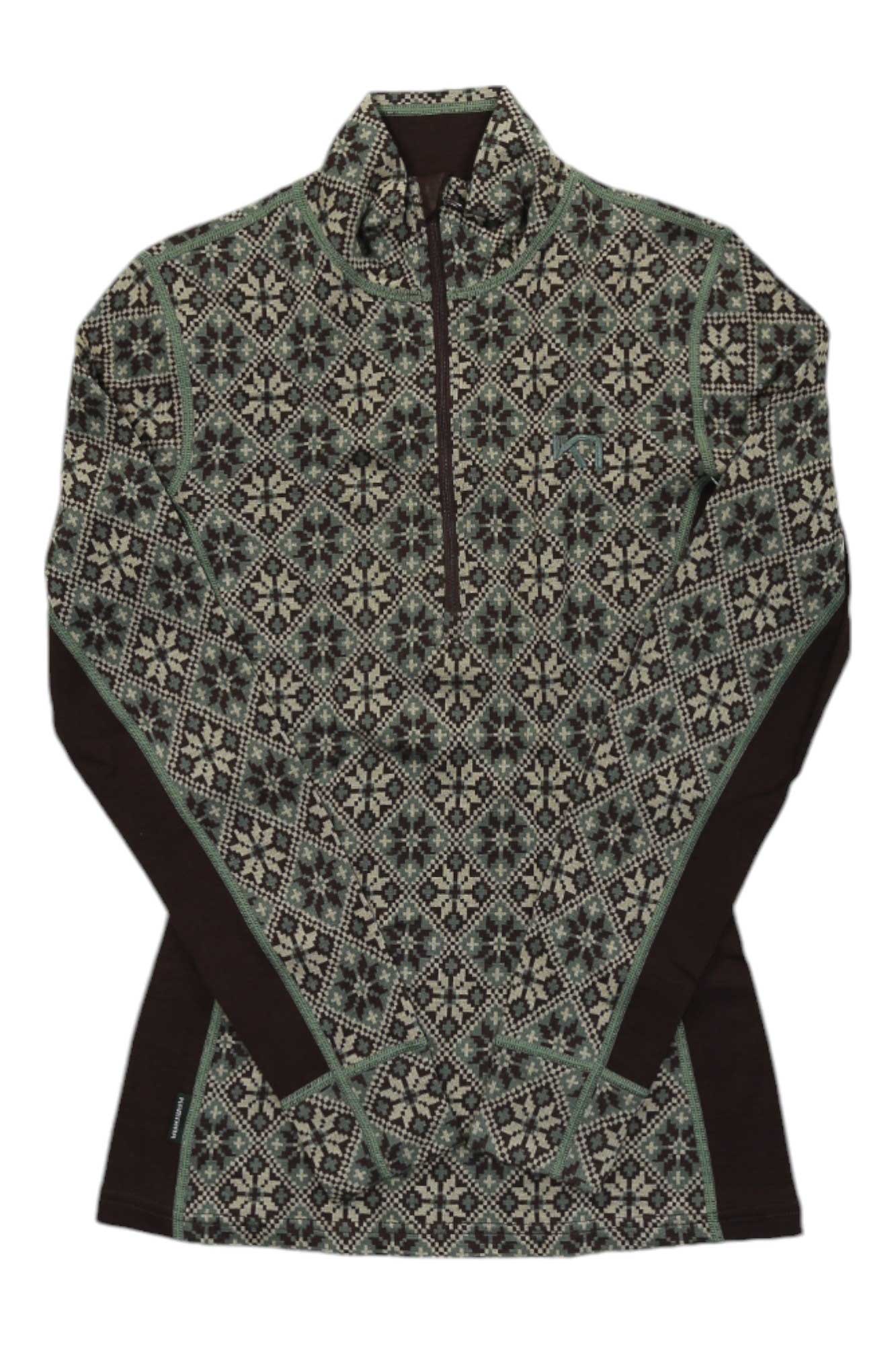 The Kari Traa Womens Rose HZ is a long sleeve base layer with green and black geometric snowflake patterns on the front, sleeves, and shoulders, plus solid black panels—ideal for outdoor adventure enthusiasts.