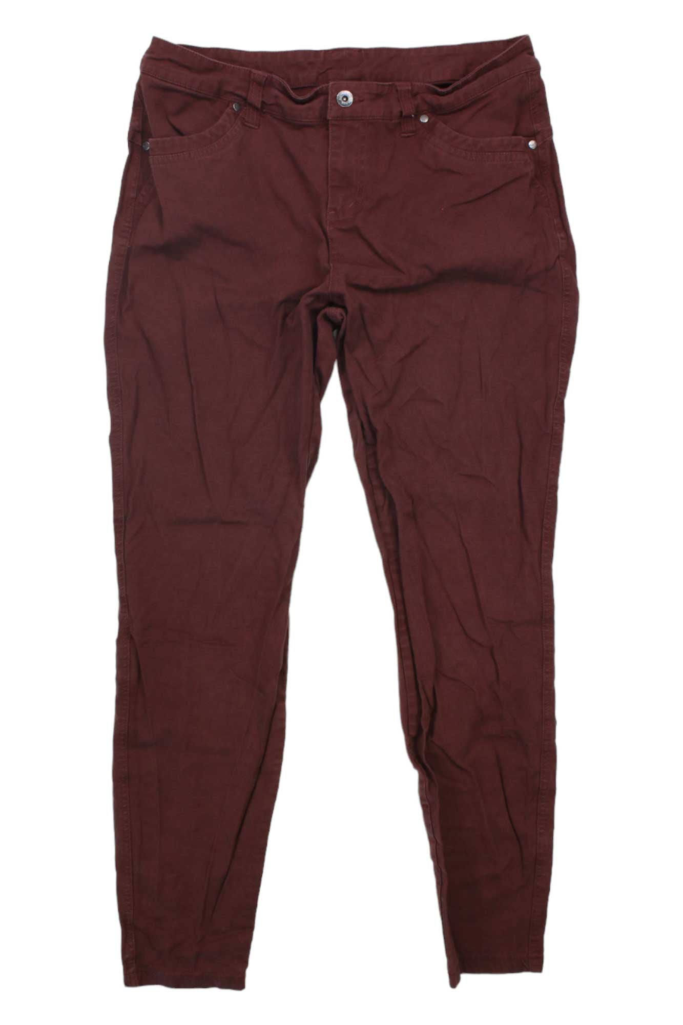 The Kuhl Womens Brooke Skinny Pants in maroon, made from stretch canvas with a skinny fit, front pockets, and button closure, are laid flat on a white background.